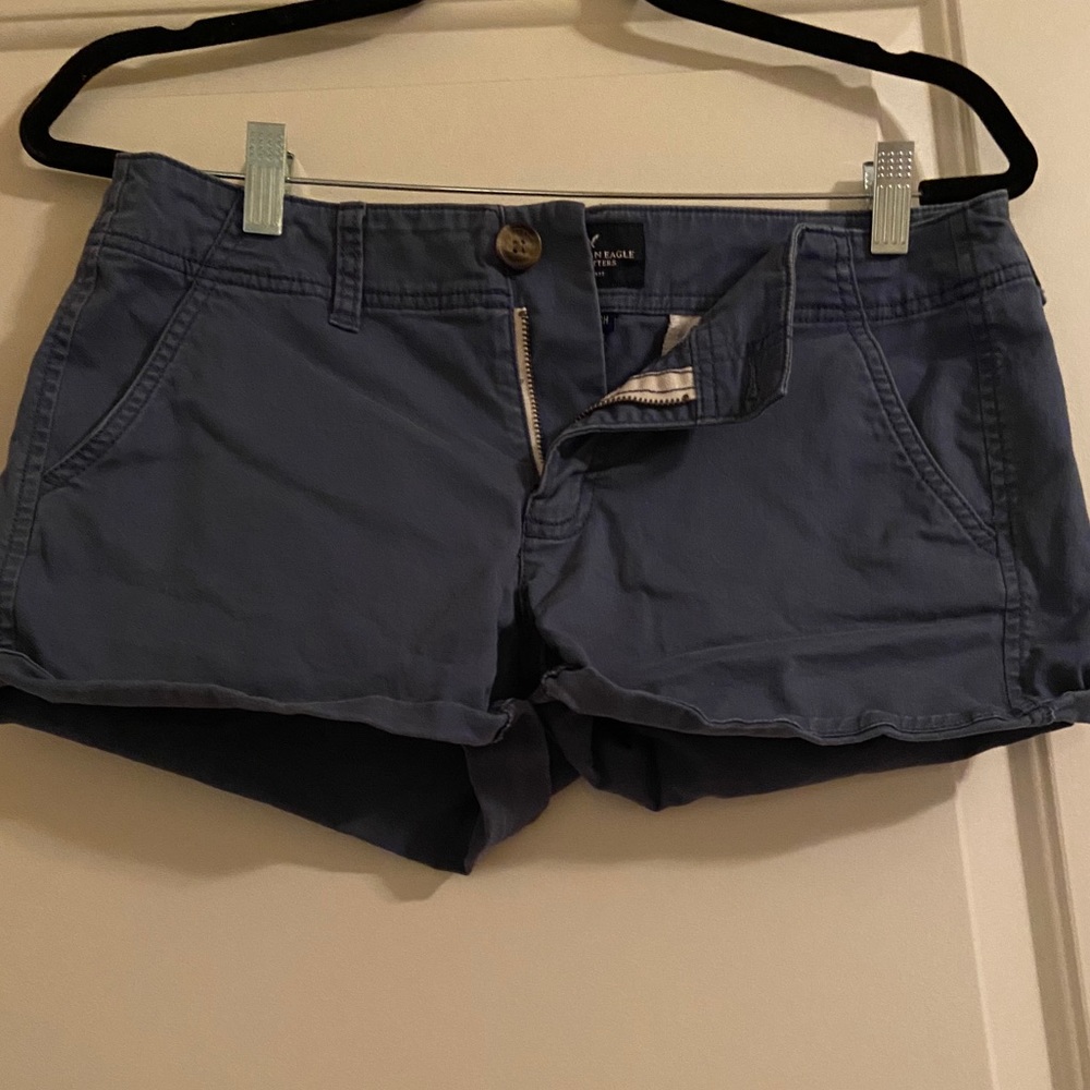 Matte blue colored short shorts.